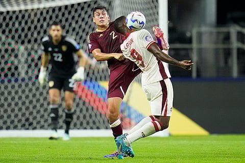 Nahuel Ferraresi and Cyle Larin compete for the ball